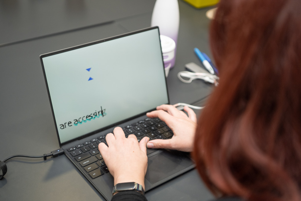 Employee working with magnification software on a laptop.